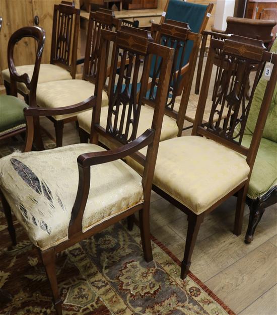 A set of four Edwardian inlaid mahogany chairs and a carver